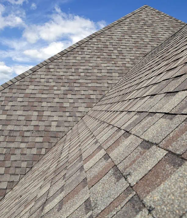 A close up of a roofing with a clock on it.