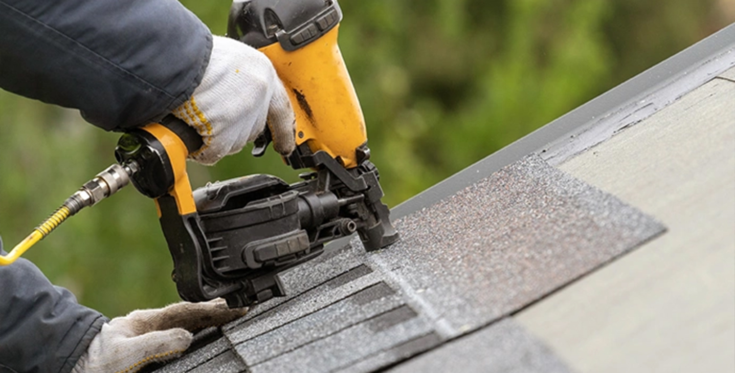 roofer installing roofing shingles