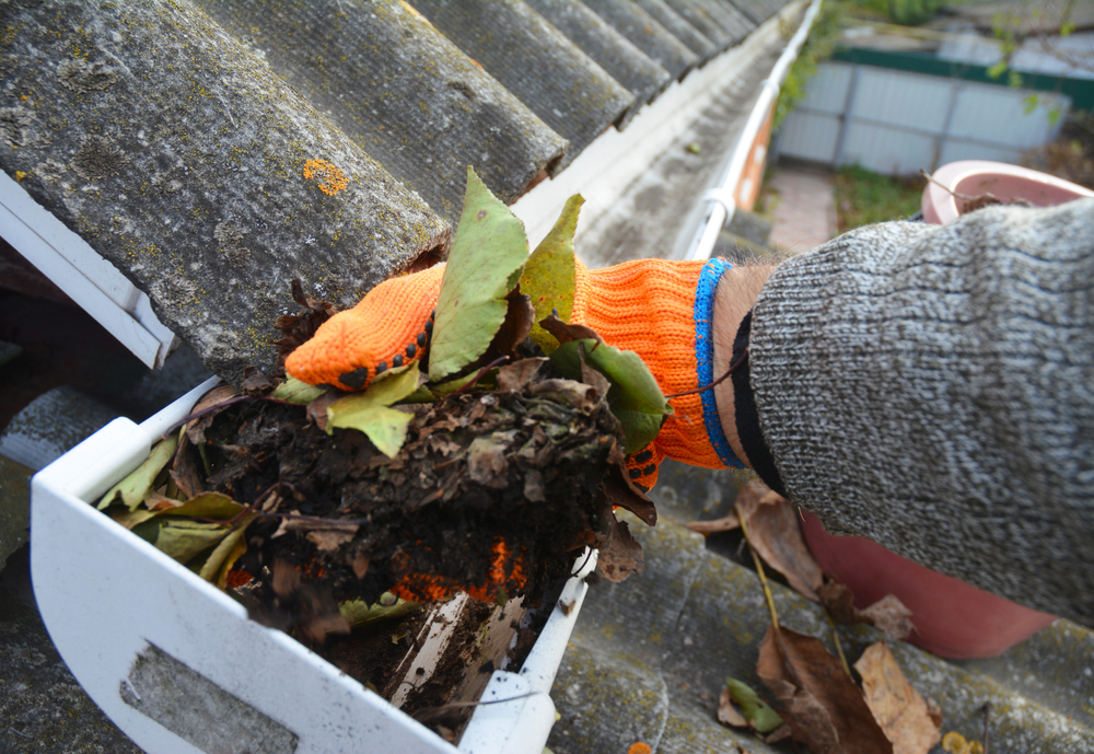 removing debris from gutters